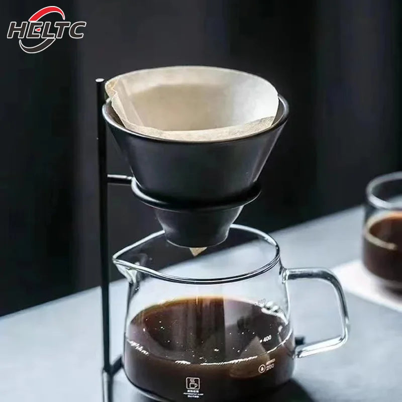 Coffee brewing setup with a glass carafe and paper filter, featuring the HELTC brand.